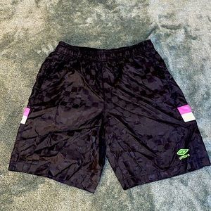 Umbro mens M shiny checkered soccer shorts with neon pink stripe.